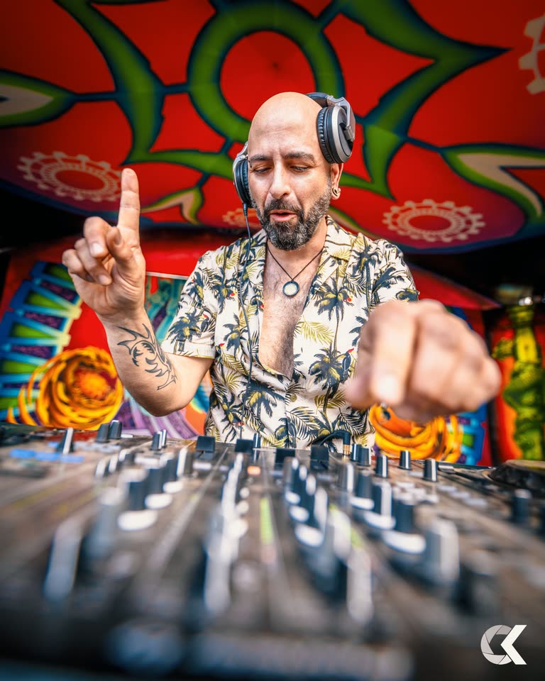 Champa conducting the floor from behind the decks