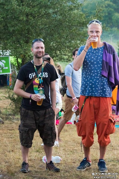 Sabretooth (Ben Fraser, left) with BMSS label boss Armin, aka Boom Shankar, both holding drinks at a summer festival.